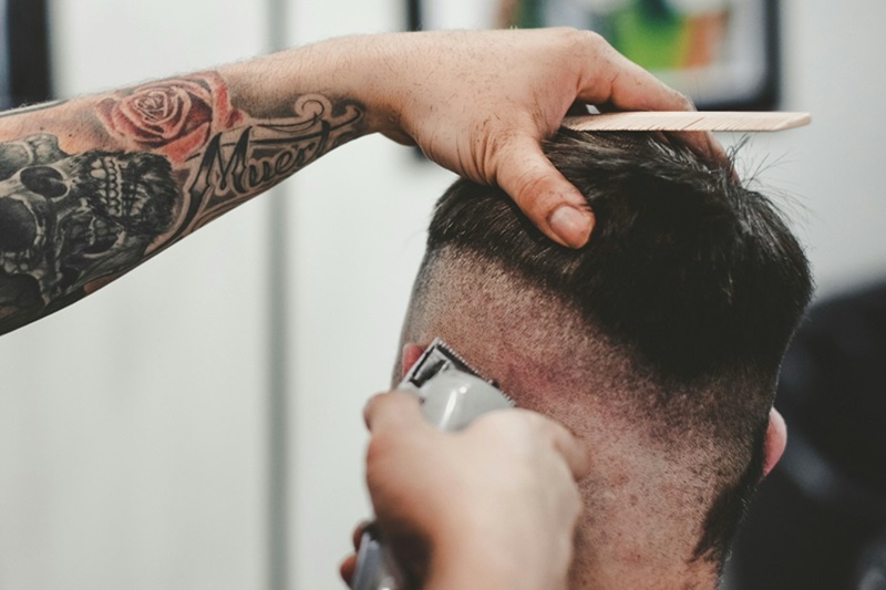 Skin fade haircut in progress at a barbers